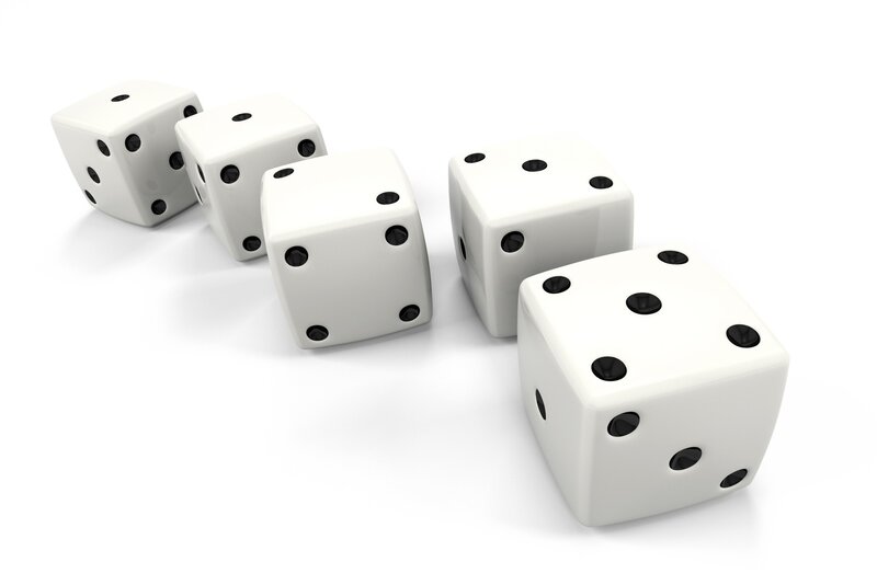 five white dice on a surface