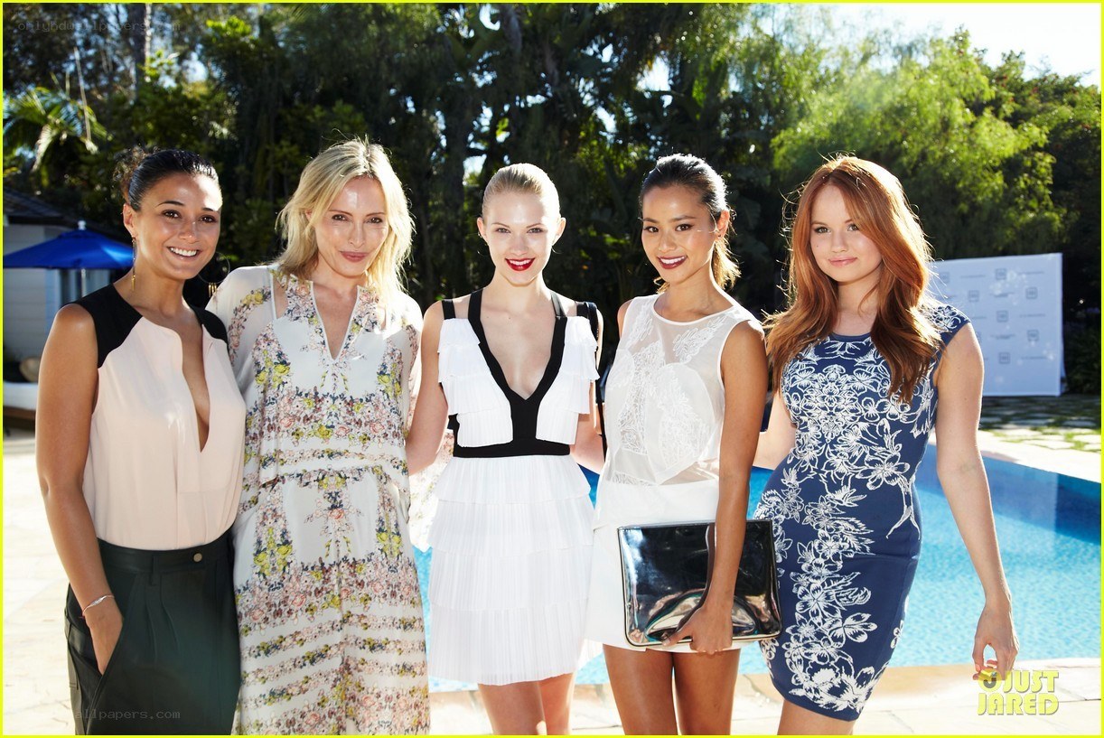 five women at poolside event