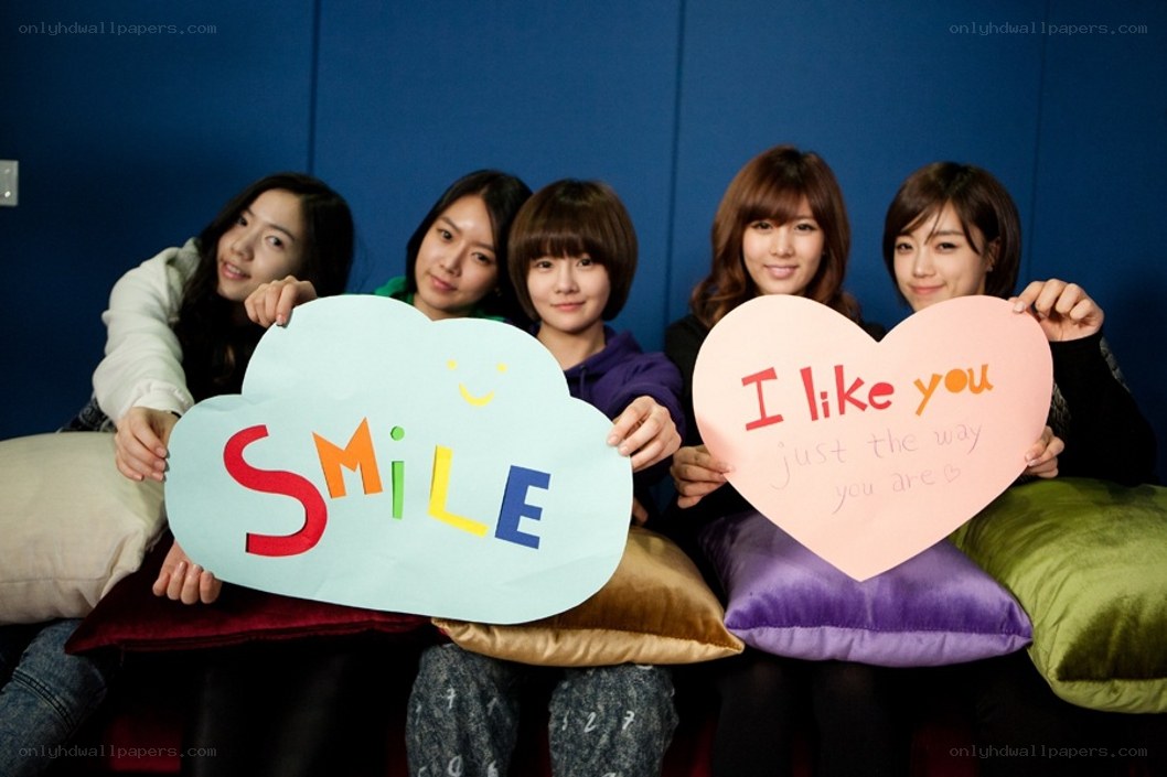 Five women holding signs