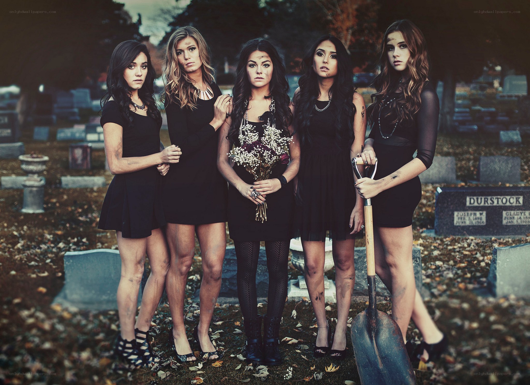 five women in a cemetery