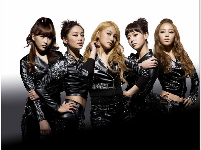 five women in black leather outfits