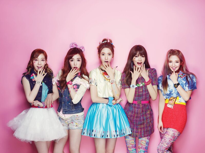 five women in colorful outfits
