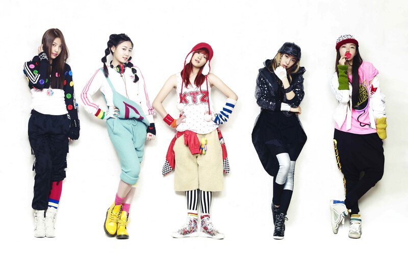 five women in colorful outfits