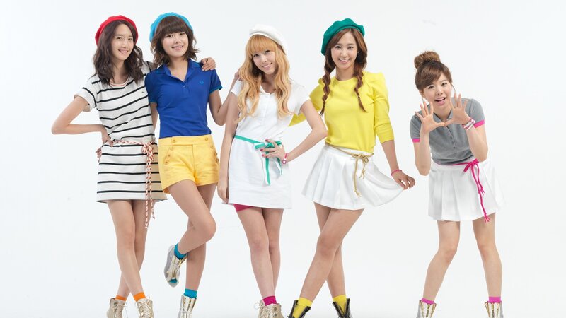 five women in colorful outfits