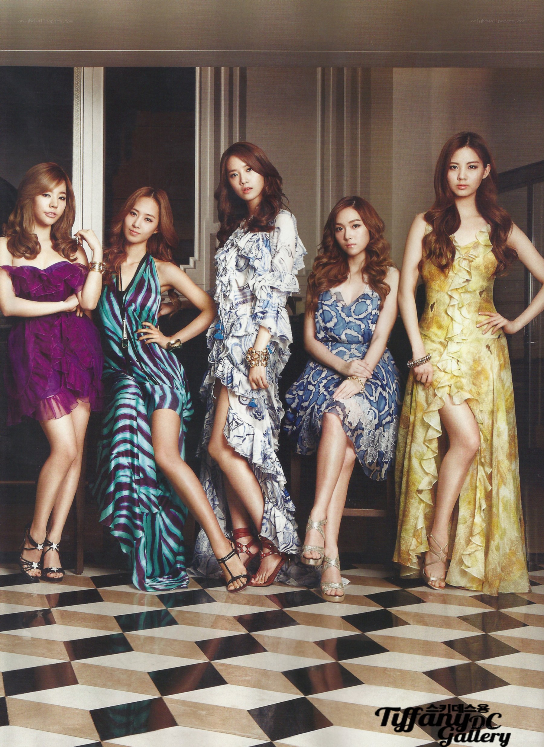 five women in elegant dresses