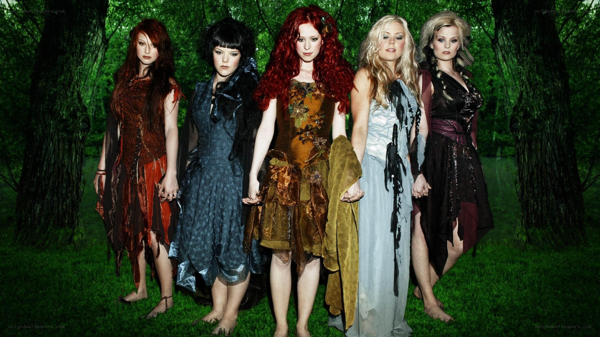 five women in forest attire