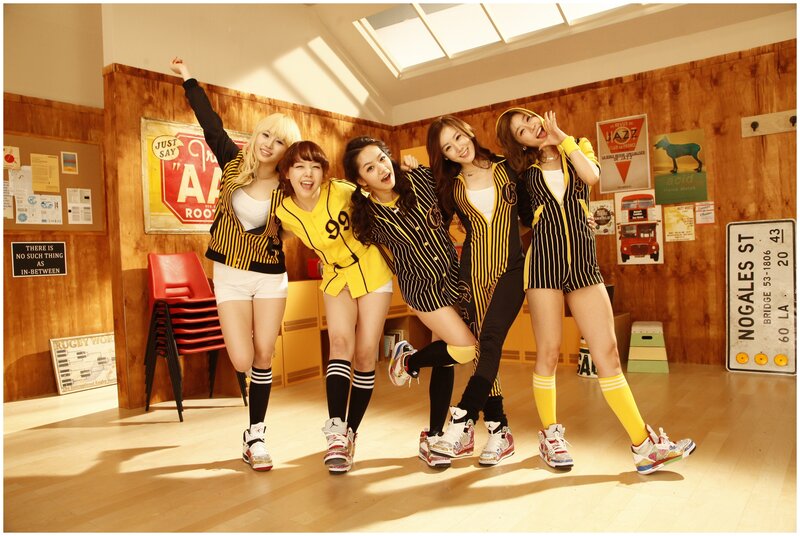 Five Women in Matching Outfits — Yellow