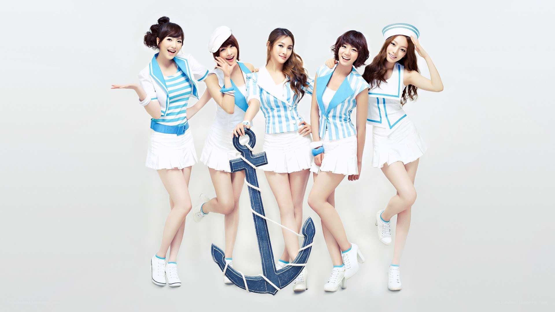 five women in nautical outfits