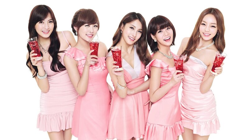 five women in pink dresses
