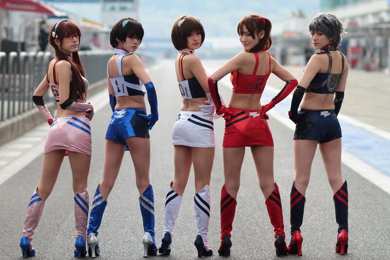 Five women in racing-themed outfits