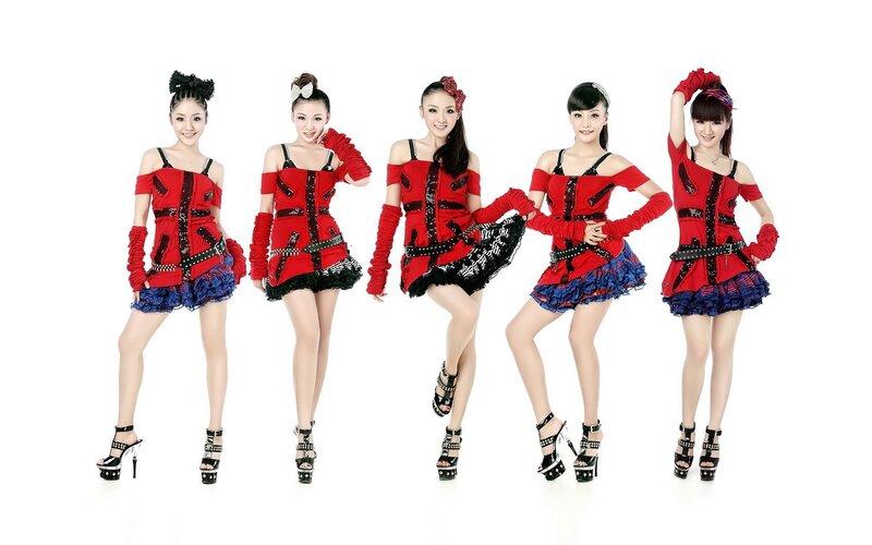 five women in red and blue outfits