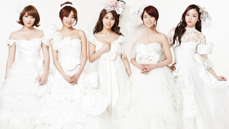 five women in wedding dresses