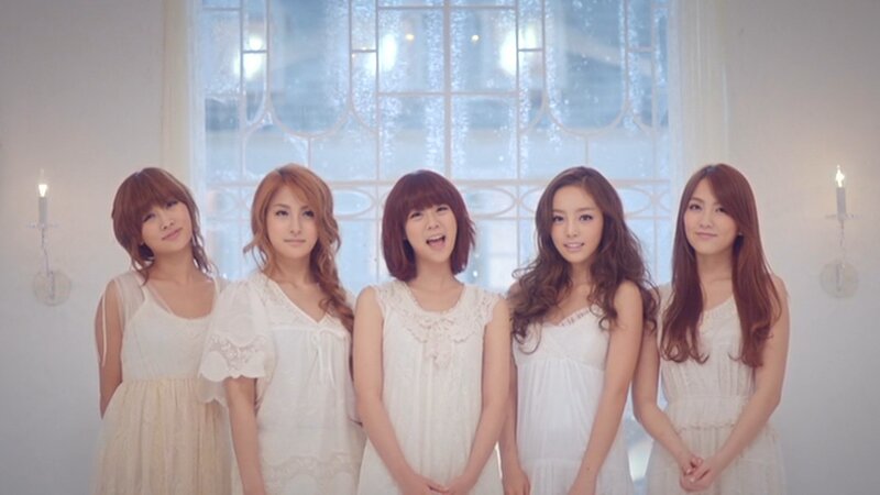 five women in white dresses