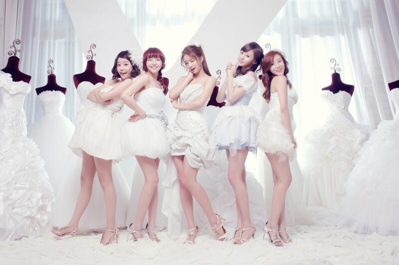 five women in white dresses