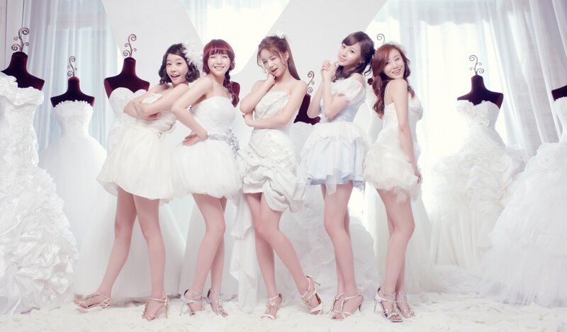 five women in white dresses