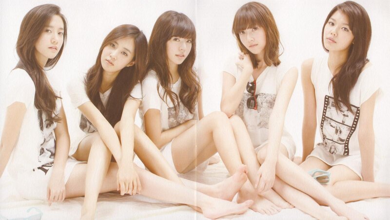five women in white outfits
