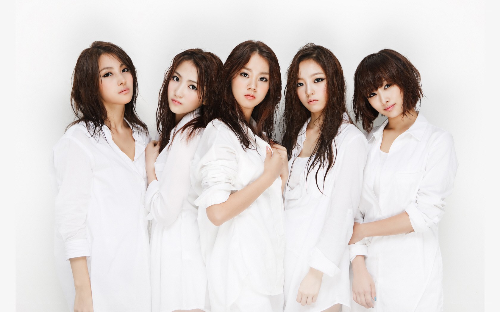 five women in white shirts