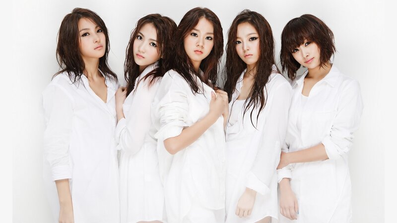 five women in white shirts