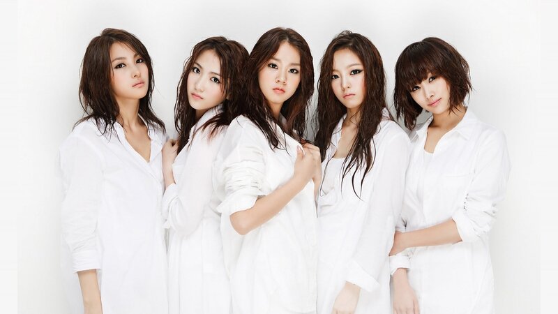 five women in white shirts
