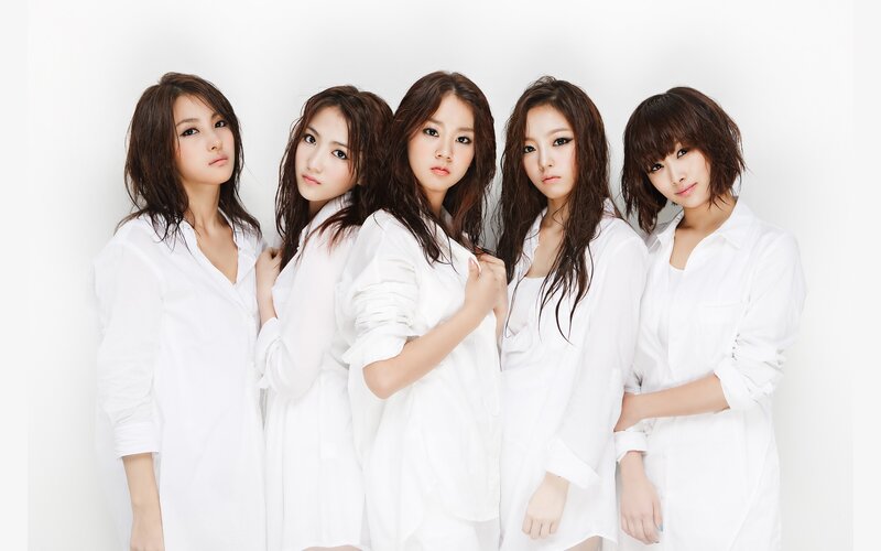 five women in white shirts