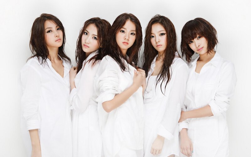 five women in white shirts