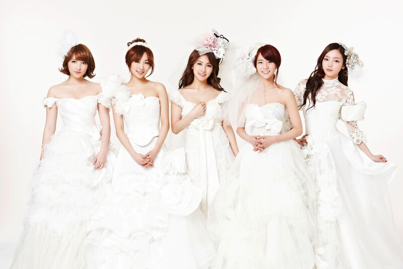 five women in white wedding dresses