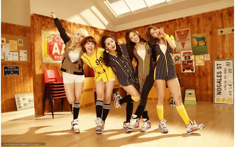five women in yellow and black outfits