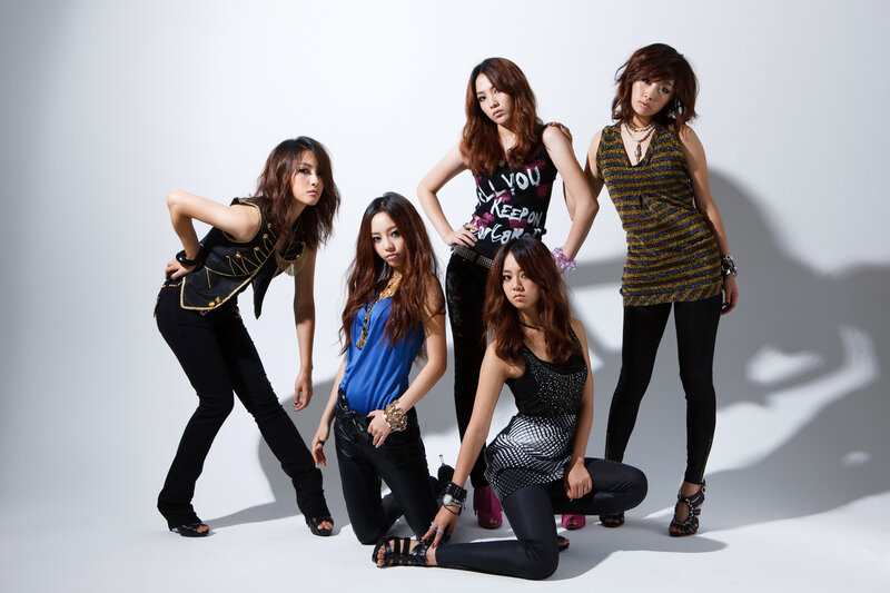 five women posing in studio