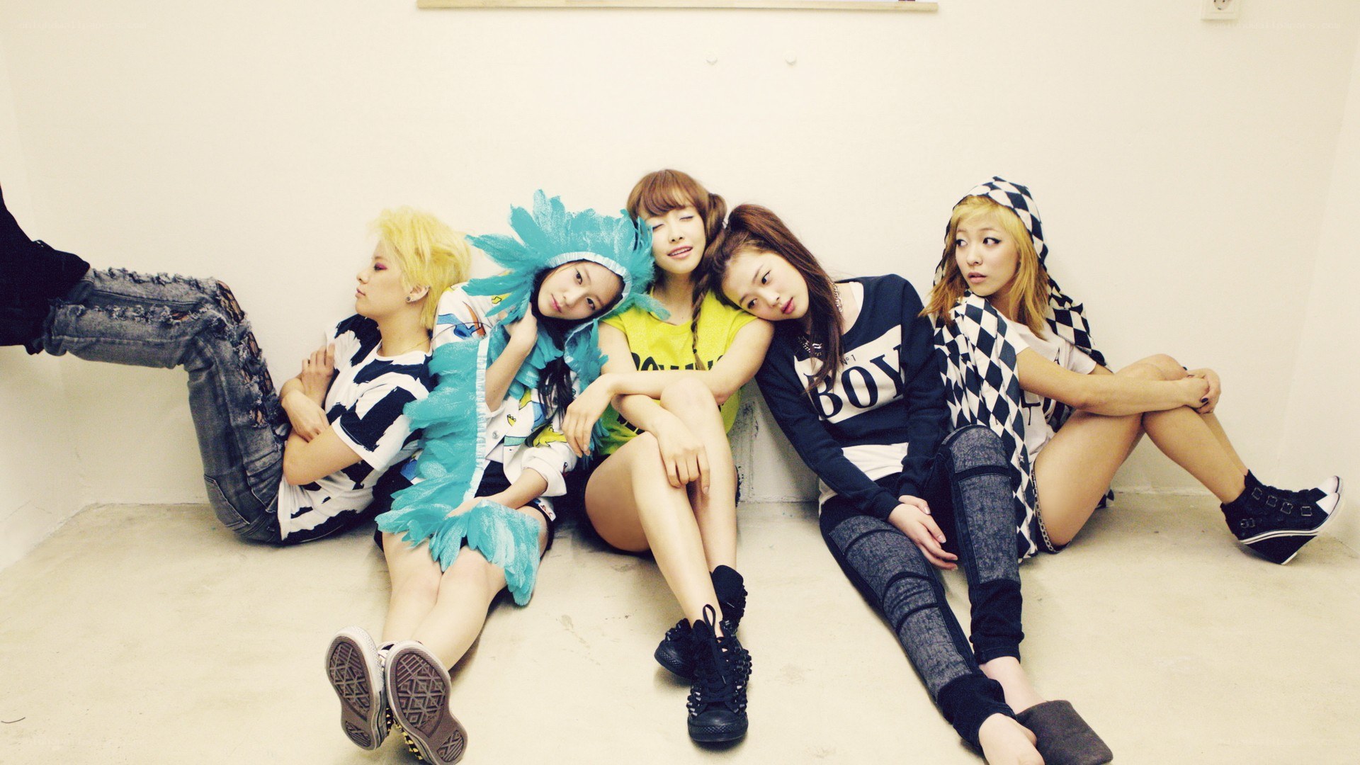 five women posing on floor
