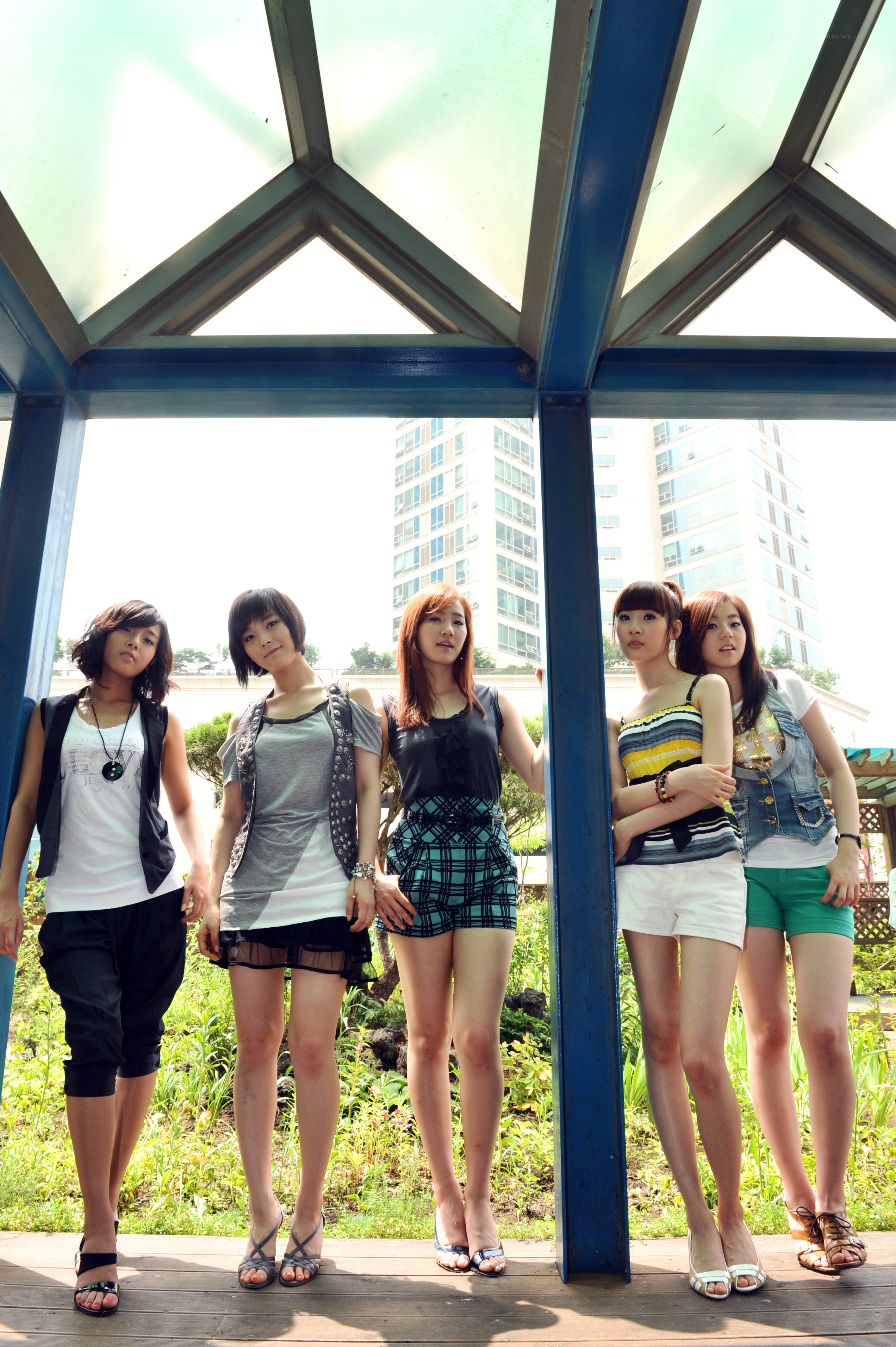 five women posing outdoors