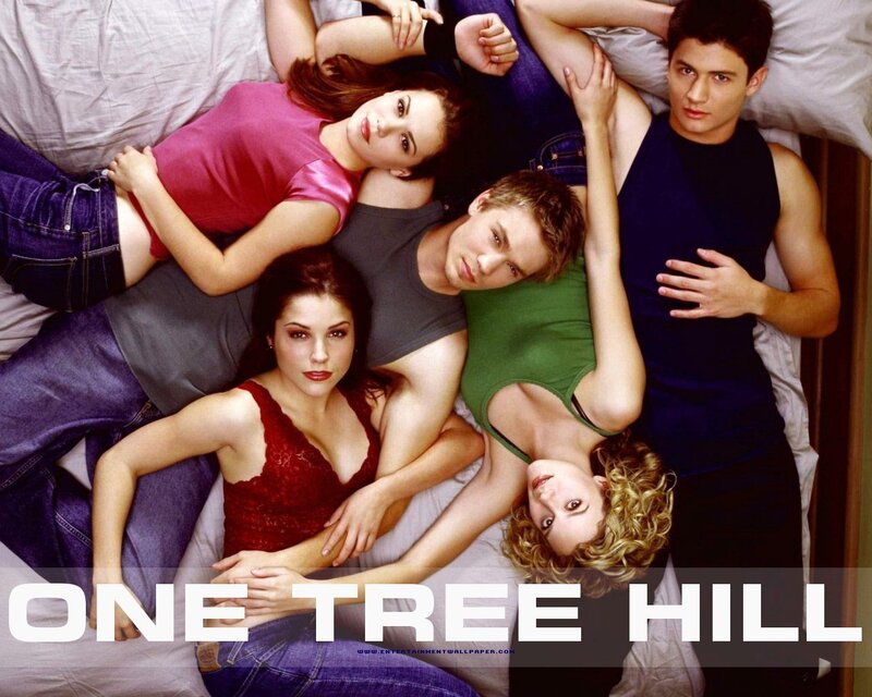 Five Young Adults on Bed