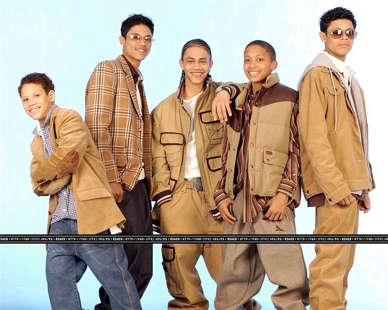 five young men in coordinated outfits