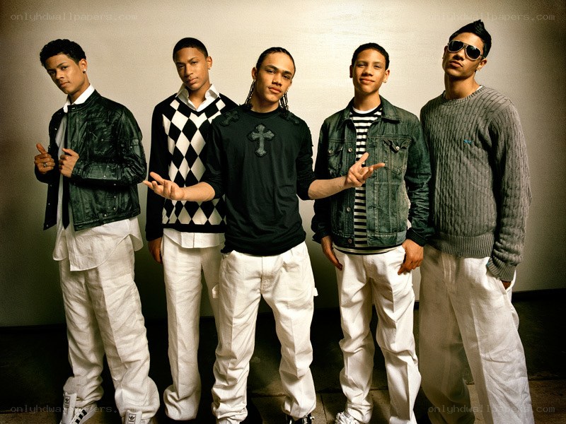 Five young men in stylish outfits