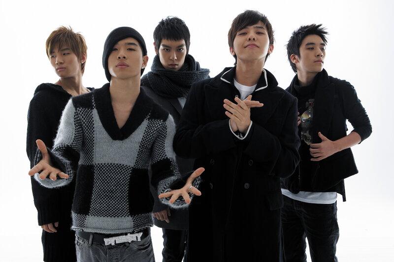 five young men in winter clothing