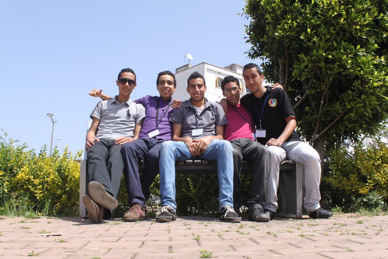 five young men on a bench