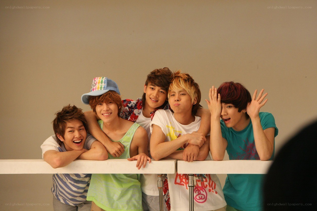 five young men posing together