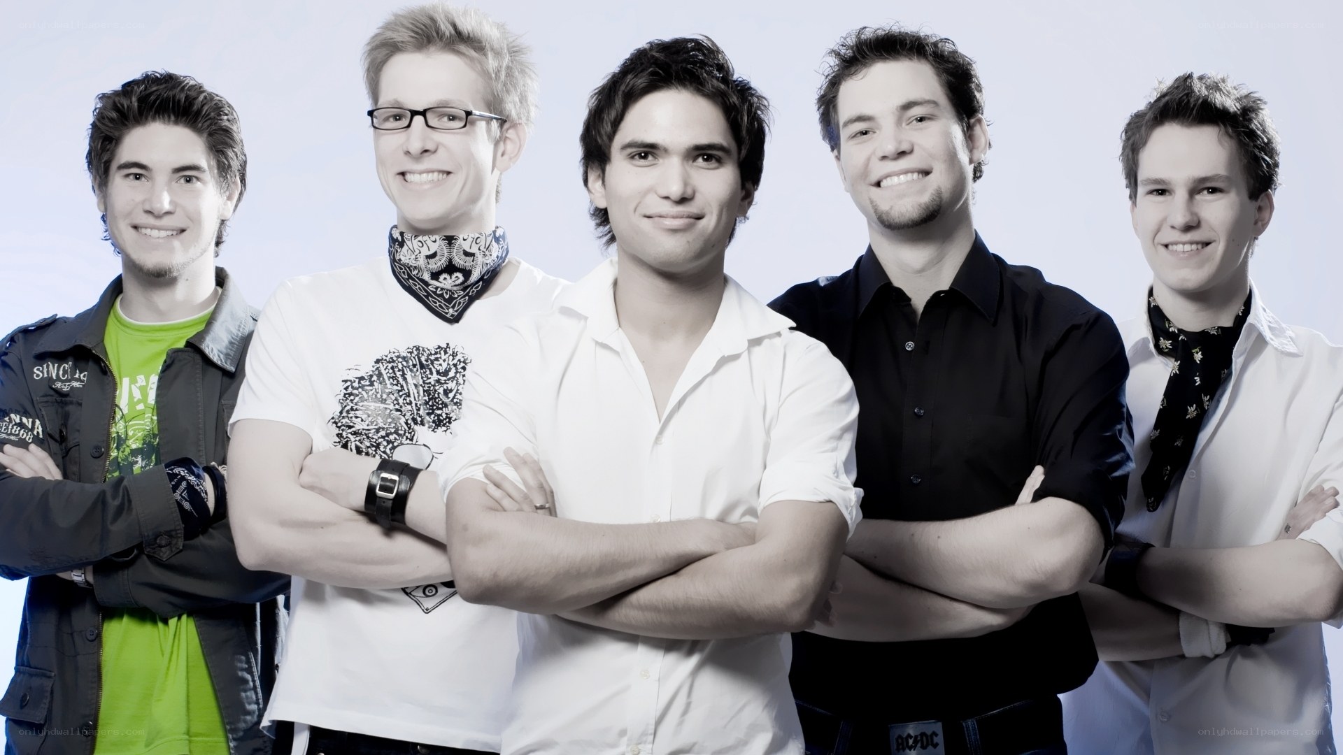 five young men posing together