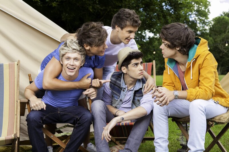 Five Young Men Sitting — Green, Relaxed, Afternoon