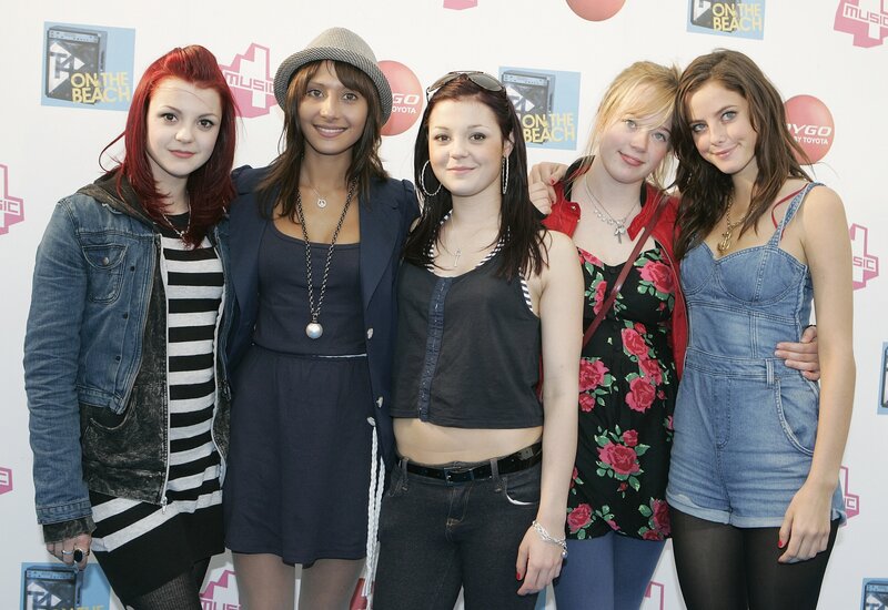 Five young women at music event