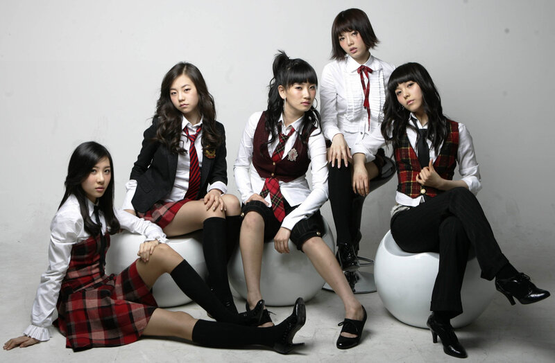 five young women in school uniforms