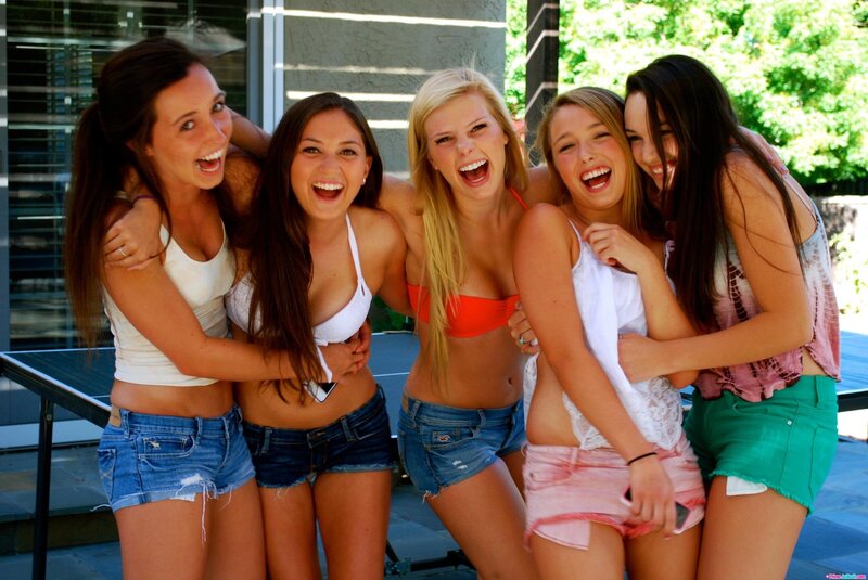 five young women laughing together