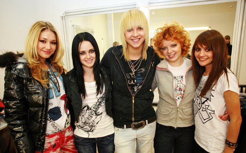 five young women posing together