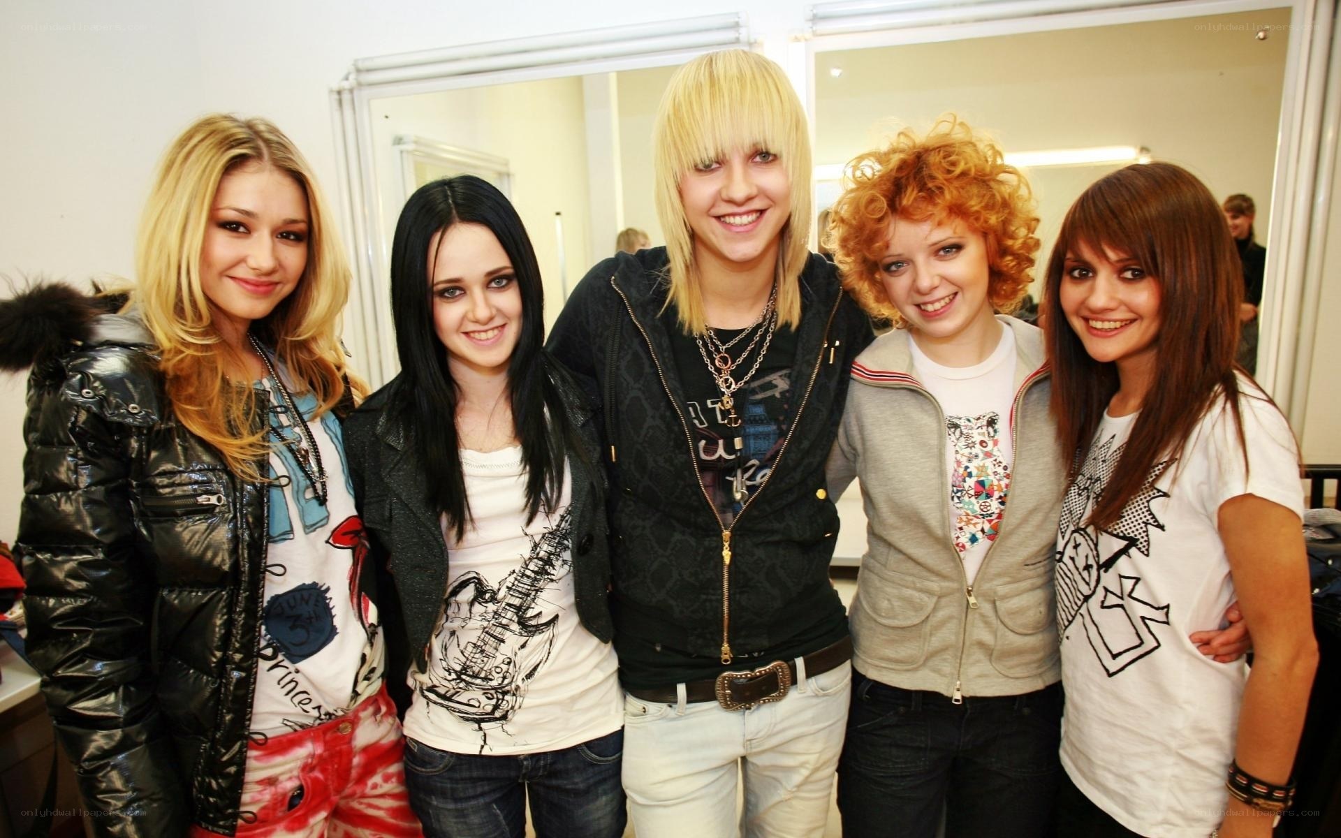 five young women posing together