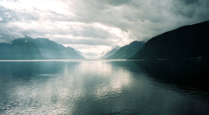 Fjord under cloudy sky