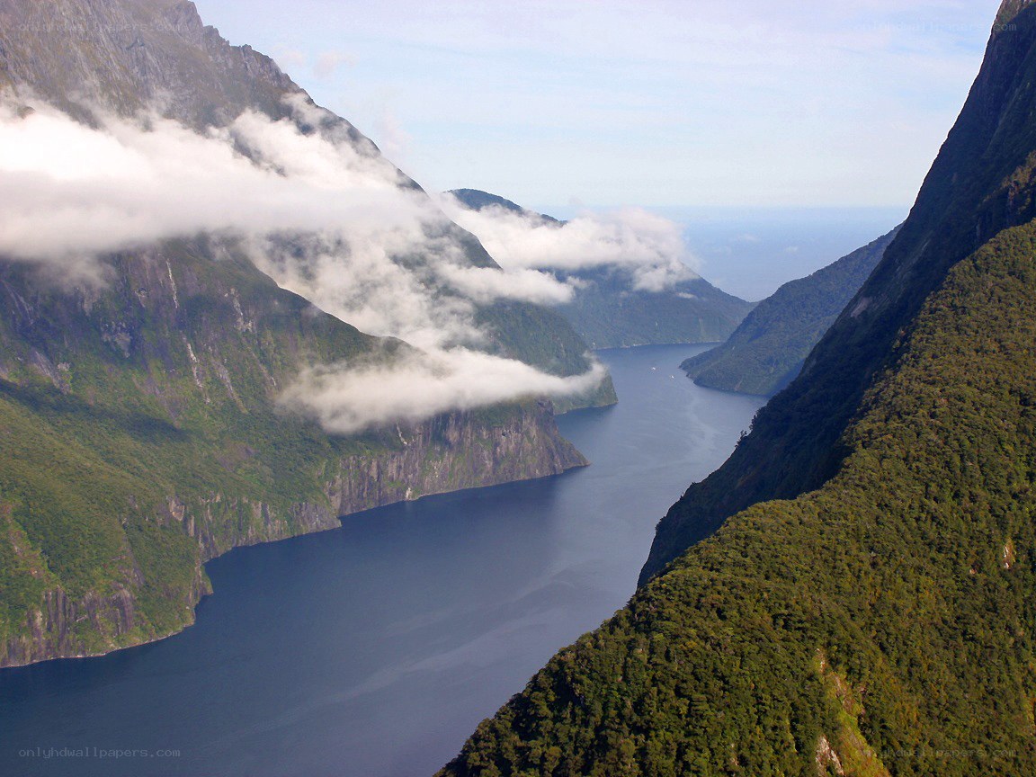 fjord with clouds and mountains