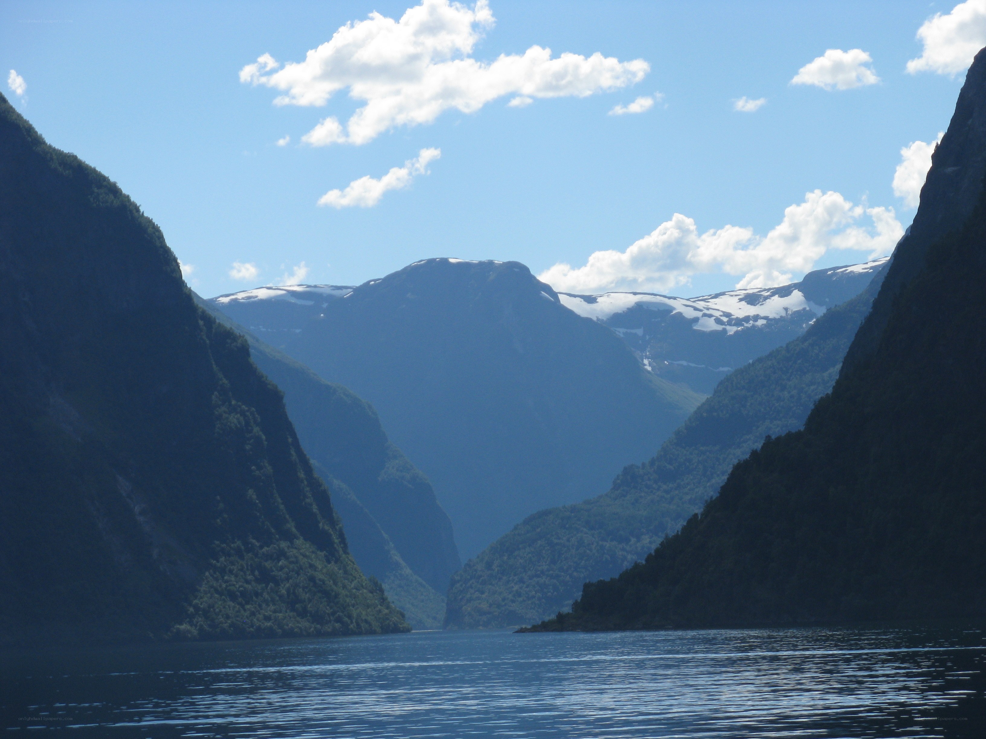 fjord with snow-capped mountains