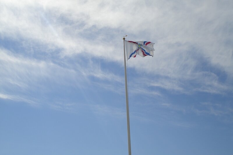 flag waving in blue sky