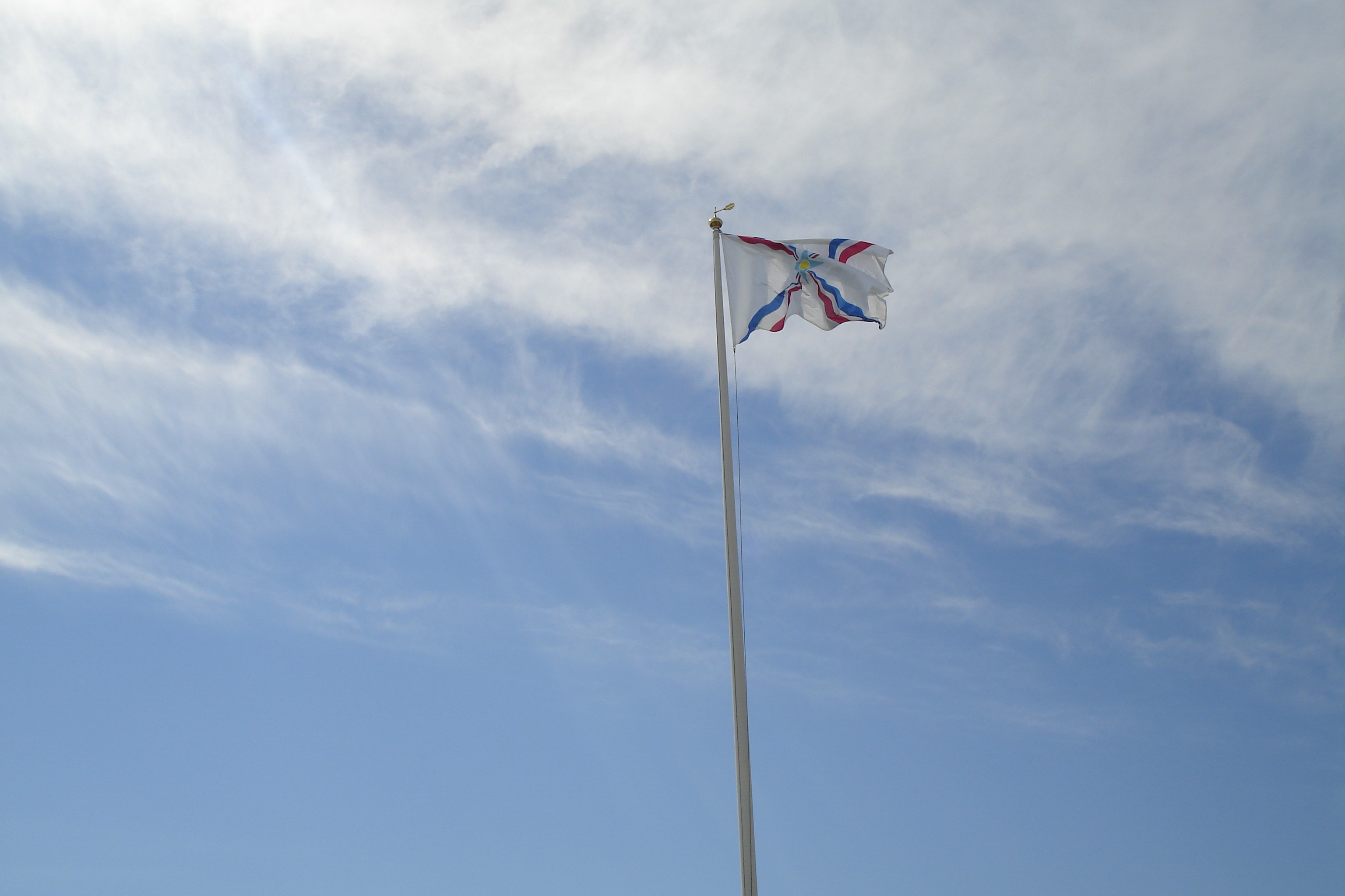 flag waving in blue sky
