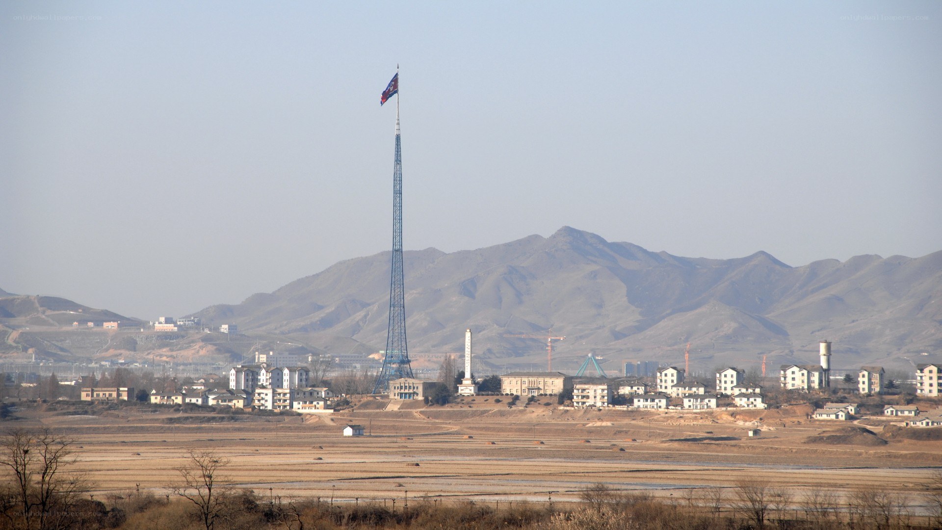 flagpole and mountains landscape