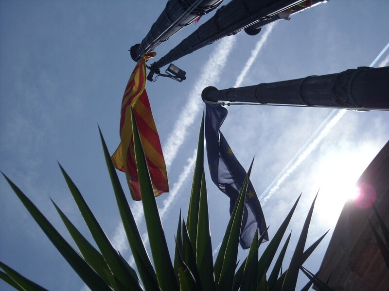 Flags against a blue sky